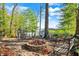Secluded backyard with seating around a fire pit is perfect for entertaining at 7003 Eagle Dr, Nineveh, IN 46164
