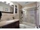Tiled bathroom features a shower over tub with glass doors and modern sink at 7003 Eagle Dr, Nineveh, IN 46164