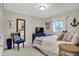 Cozy bedroom featuring a bed, chair, mounted TV and lots of nautical decor at 7003 Eagle Dr, Nineveh, IN 46164
