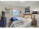 Cozy bedroom featuring a bed, mounted TV, an anchor, and large windows at 7003 Eagle Dr, Nineveh, IN 46164