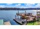 Large dock equipped with a sun deck and boat lift provides an ideal space for lakeside enjoyment at 7003 Eagle Dr, Nineveh, IN 46164