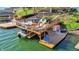 Waterfront features include a composite deck with bar and lounging area on deep water, with space for boat parking at 7003 Eagle Dr, Nineveh, IN 46164