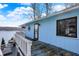 Exterior view of the home featuring a balcony, stairs, and lake views at 7003 Eagle Dr, Nineveh, IN 46164