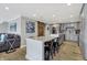 Stylish kitchen with modern appliances, gray cabinets, granite countertops, and convenient breakfast bar seating at 7003 Eagle Dr, Nineveh, IN 46164