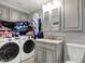 Laundry room with washer, dryer, sink, and cabinet storage at 7003 Eagle Dr, Nineveh, IN 46164