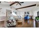Bright and airy living room showcasing hardwood floors, vaulted ceilings, and access to multiple rooms at 7003 Eagle Dr, Nineveh, IN 46164