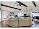 Open living room with hardwood floors, vaulted ceilings, and scenic lake views from multiple windows at 7003 Eagle Dr, Nineveh, IN 46164