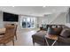 Comfortable living area with hardwood floors, natural light, and lake views, perfect for relaxation and entertainment at 7003 Eagle Dr, Nineveh, IN 46164