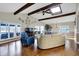 Living room with vaulted ceilings, wood beams, skylight, and a lake view at 7003 Eagle Dr, Nineveh, IN 46164