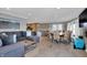 Spacious open-concept living area with hardwood floors, modern decor, and seamless flow to the kitchen at 7003 Eagle Dr, Nineveh, IN 46164