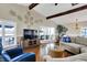 Bright living room with hardwood floors, vaulted ceilings, lake views, and comfortable seating arrangement at 7003 Eagle Dr, Nineveh, IN 46164