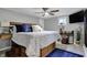 Bedroom featuring blue and white bedding, a ceiling fan, and a mounted TV at 7003 Eagle Dr, Nineveh, IN 46164