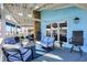 Covered porch with comfortable seating, stone fireplace, and tranquil lake view offers a relaxing space at 7003 Eagle Dr, Nineveh, IN 46164