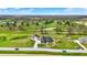 Aerial view of property, home, garage, and surrounding landscape, including golf course at 706 E 750 N, Lebanon, IN 46052