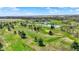 Scenic aerial view of the community golf course with lush green fairways and beautiful pond views at 706 E 750 N, Lebanon, IN 46052