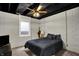 Cozy basement bedroom with painted brick wall, carpeted flooring, and natural light from window at 706 E 750 N, Lebanon, IN 46052