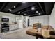 Finished basement with kitchenette and a cozy seating area, perfect for entertaining and relaxing at 706 E 750 N, Lebanon, IN 46052