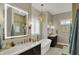 Bright bathroom featuring standalone tub, double vanity, walk-in shower and modern lighting at 706 E 750 N, Lebanon, IN 46052