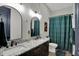 Elegant bathroom with double vanity, granite countertop, dark cabinets and decorative mirrors at 706 E 750 N, Lebanon, IN 46052