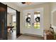 Bright entryway with white trim doors, decorative wreaths, and a view of the office space at 706 E 750 N, Lebanon, IN 46052