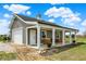 Detached garage/workshop with white doors, covered porch, and ample storage at 706 E 750 N, Lebanon, IN 46052
