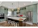 Beautiful kitchen showcasing custom cabinetry, a center island, and premium stainless steel appliances at 706 E 750 N, Lebanon, IN 46052