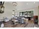 Open-concept living room showcasing modern furnishings and a seamless transition to the kitchen area at 706 E 750 N, Lebanon, IN 46052