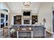 Spacious living room with stone fireplace, built-in bookshelves, and comfortable seating arrangement at 706 E 750 N, Lebanon, IN 46052
