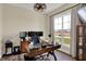 Well-lit office space featuring a large window, modern desk, and functional workspace setup at 706 E 750 N, Lebanon, IN 46052