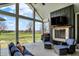 Relaxing outdoor patio featuring a stone fireplace, outdoor seating, and beautiful views at 706 E 750 N, Lebanon, IN 46052