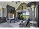 Outdoor patio with stone fireplace, mounted TV, furniture and golf course view at 706 E 750 N, Lebanon, IN 46052