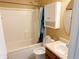 Bathroom with a tub-shower, vanity with sink, medicine cabinet and a toilet at 7201 Barnwell Pl, Indianapolis, IN 46217