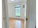Light-filled bedroom with hardwood floors and a window letting in natural light at 7201 Barnwell Pl, Indianapolis, IN 46217
