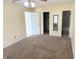 Large bedroom with multiple doorways and neutral walls and carpeting at 7201 Barnwell Pl, Indianapolis, IN 46217