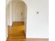 Welcoming entryway with hardwood floors and an arched doorway at 7201 Barnwell Pl, Indianapolis, IN 46217