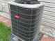 Close-up of the Bryant AC unit on a concrete slab and siding at 7201 Barnwell Pl, Indianapolis, IN 46217