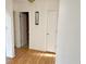 Bright hallway featuring hardwood floors and classic white trim at 7201 Barnwell Pl, Indianapolis, IN 46217