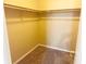 Spacious walk-in closet with carpeting and wooden shelving at 7201 Barnwell Pl, Indianapolis, IN 46217
