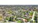Aerial view of an estate home surrounded by lush greenery, mature trees, and a circular driveway at 7545 Chablis Cir, Indianapolis, IN 46278