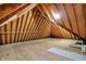 Spacious unfinished attic with wood flooring and exposed rafters, perfect for storage or future expansion at 7545 Chablis Cir, Indianapolis, IN 46278