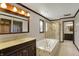 Bathroom features a tub, shower, and vanity with wood cabinets at 7545 Chablis Cir, Indianapolis, IN 46278