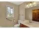 Bright bathroom with single vanity, light fixture, and window at 7545 Chablis Cir, Indianapolis, IN 46278