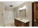 Bathroom offers a shower-tub combination and wooden vanity at 7545 Chablis Cir, Indianapolis, IN 46278