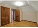 Bonus room with hardwood floors and multiple doorways at 7545 Chablis Cir, Indianapolis, IN 46278