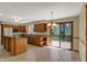 Large kitchen features oak cabinets, stainless steel appliances and large sliding doors to deck at 7545 Chablis Cir, Indianapolis, IN 46278