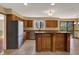 Spacious kitchen with stainless steel appliances, breakfast bar and adjacent dining area at 7545 Chablis Cir, Indianapolis, IN 46278