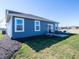 Modern house showcasing a patio with outdoor seating and a well-maintained lawn at 7636 Big Bend Blvd, Camby, IN 46113