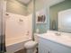 Clean, well-lit bathroom with a tub, shower, and modern white vanity at 7636 Big Bend Blvd, Camby, IN 46113