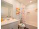 Well-lit bathroom with patterned walls, a pedestal sink, and a shower-tub combination at 7636 Big Bend Blvd, Camby, IN 46113