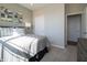 Well-lit bedroom featuring a comfortable bed, soft carpet, and modern design at 7636 Big Bend Blvd, Camby, IN 46113